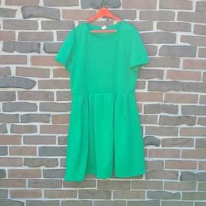 Plus size little green dress fit and flare.